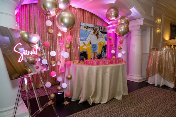 Sienna's Bat Mitzvah entrance with mirrored logo sign and balloon garlands