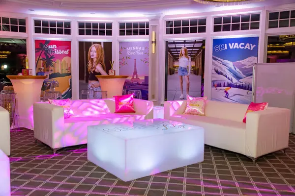 Sienna's Bat Mitzvah lounge with Sun Kissed and Ski Vacay destination posters