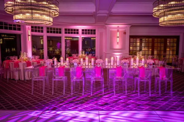 Sienna's Bat Mitzvah mirrored kids table with ghost chairs in pink uplighting