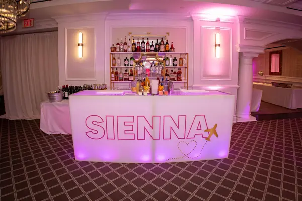 Sienna's Bat Mitzvah glowing branded bar with airplane logo