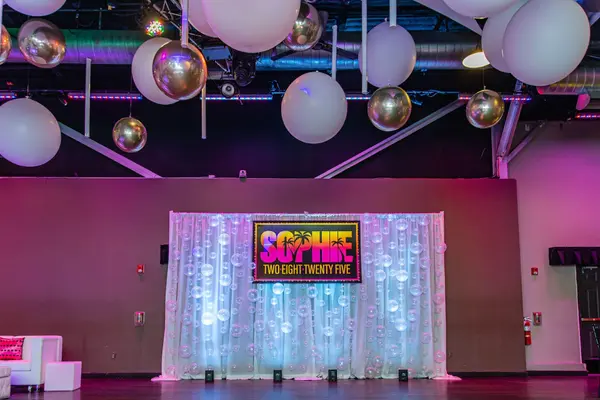 Sophie's Bat Mitzvah logo sign on a bubble-balloon backdrop