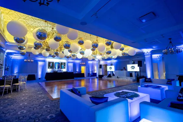 Ballroom view with balloon ceiling and white logo lounge