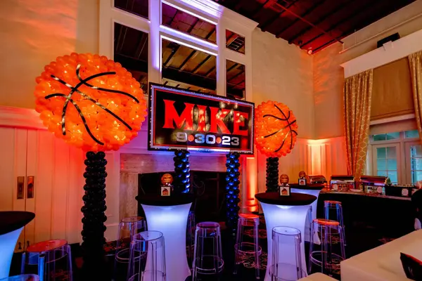 Giant basketball balloon columns and Mike's Bar Mitzvah logo sign
