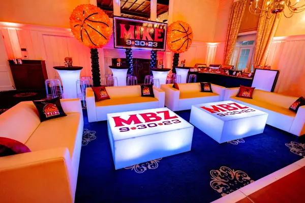 Mike's Bar Mitzvah lounge with glowing MBZ tables and basketball balloons