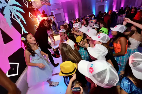 The honoree and guests in trucker hats at Abby's Bat Mitzvah