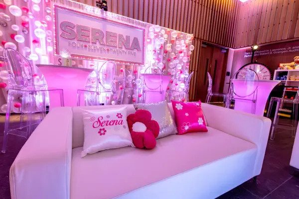 Serena's Bat Mitzvah white lounge sofa with custom logo pillows