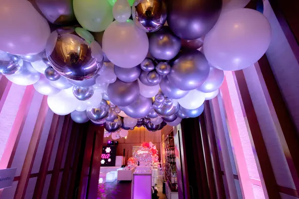 Organic balloon ceiling décor in the entry hall at Serena's Bat Mitzvah