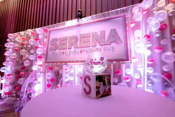 High-top centerpiece and Serena logo sign at Serena's Bat Mitzvah