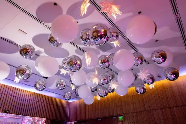 Balloon and paper star ceiling installation at Serena's Bat Mitzvah