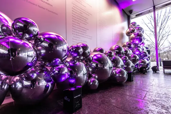 Chrome balloon garland with purple uplighting at Serena's Bat Mitzvah