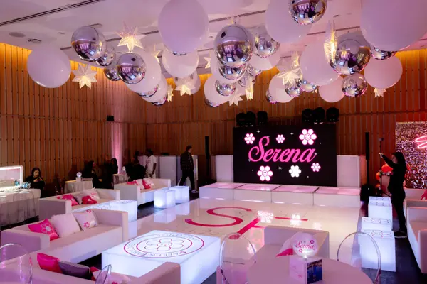Serena's Bat Mitzvah lounge room with LED logo screen and balloon ceiling