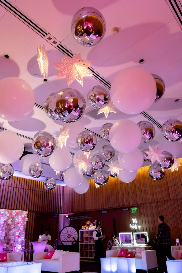 Balloons and lit paper stars across the ceiling at Serena's Bat Mitzvah