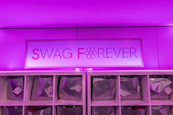 Swag Forever sign over cubbies of gift bags at Serena's Bat Mitzvah