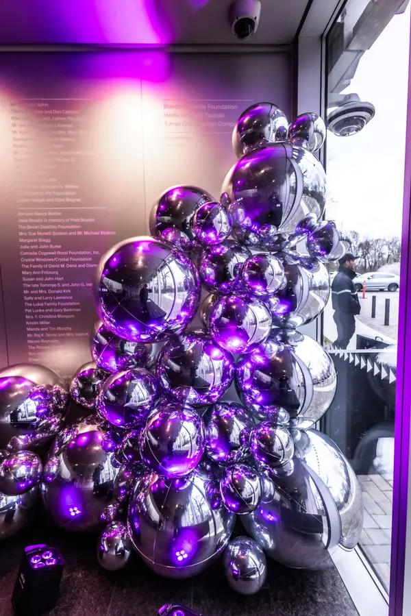 Stacked chrome balloon sculpture by the glass entry at Serena's Bat Mitzvah