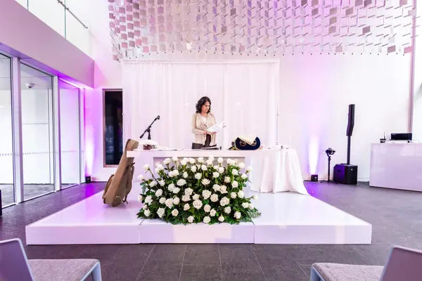 White rose florals on the ceremony stage at Serena's Bat Mitzvah