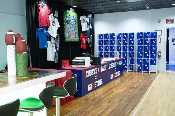 Swag station with cubby wall and football centerpieces at Jeremy's Bar Mitzvah