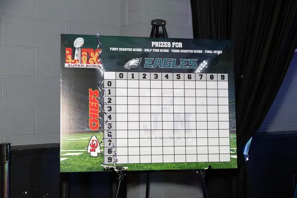 Chiefs versus Eagles Super Bowl squares board on an easel