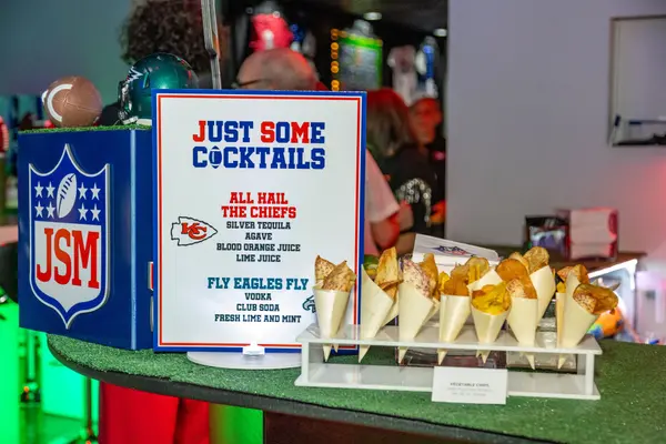 Just Some Cocktails signature drink sign at the JSM-branded bar