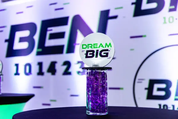 Dream Big logo high-top centerpiece in front of Ben's Bar Mitzvah backdrop
