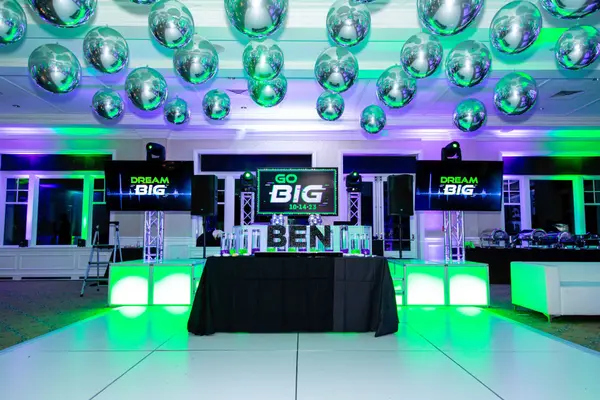 Ben's Bar Mitzvah DJ stage with Go Big screens and candle display
