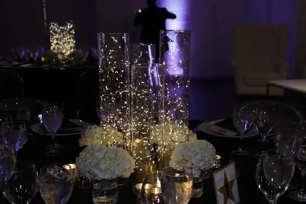 Fairy light cylinders and white hydrangea centerpiece at Emme's Bat Mitzvah