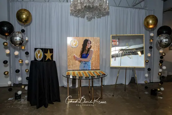 Emme's Bat Mitzvah entrance with photo board, gift box and balloons