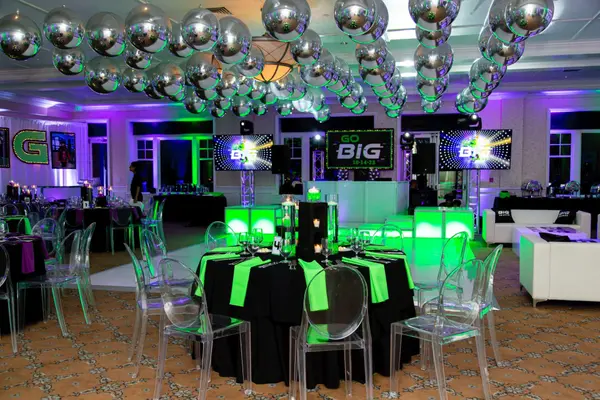 Ben's Bar Mitzvah table setting facing the Go Big dance floor