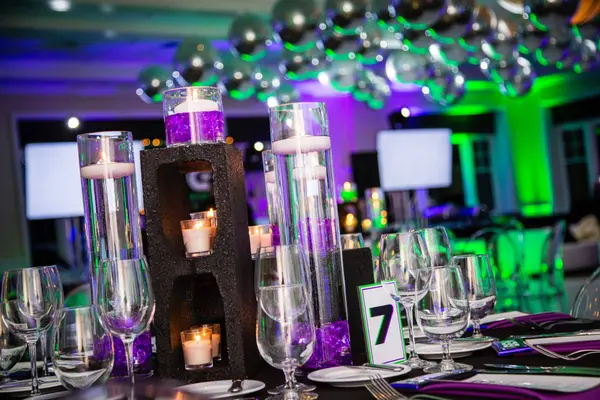 Glitter block centerpiece with floating candles at Ben's Bar Mitzvah