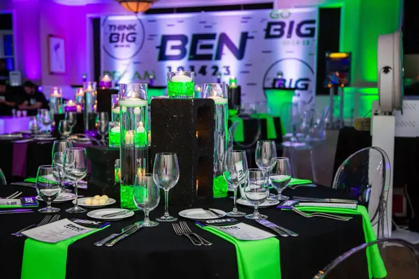 Ben's Bar Mitzvah place setting with menus and green gem centerpiece