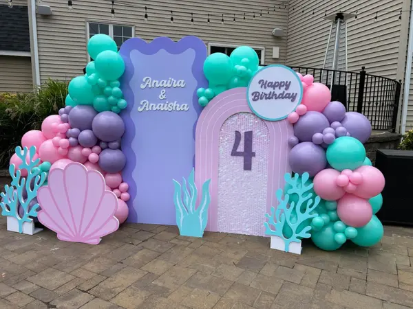 Organic Balloon Garland Over Chiara Arches