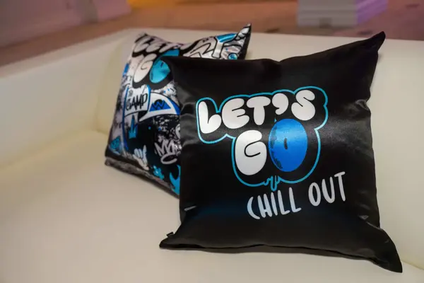 Owen's Bar Mitzvah custom logo pillows on white lounge furniture