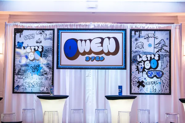 Owen's Bar Mitzvah logo sign backdrop with graffiti panels