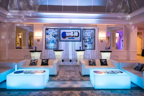 Owen's Bar Mitzvah lounge with LED logo tables and draped logo backdrop