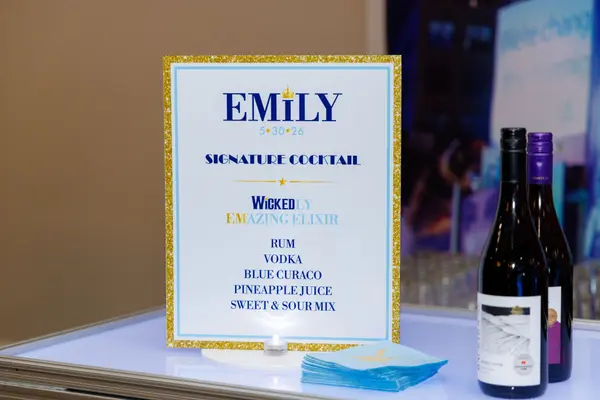Emily's Bat Mitzvah signature cocktail sign on the lit bar