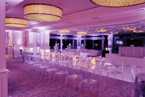 Ella's Bat Mitzvah mirrored dining table with ghost chairs and candle runner
