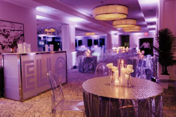 Ella's Bat Mitzvah sequin cocktail table beside the Ella branded bar