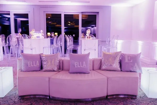 Ella's Bat Mitzvah curved lounge sofa with Ella logo pillows