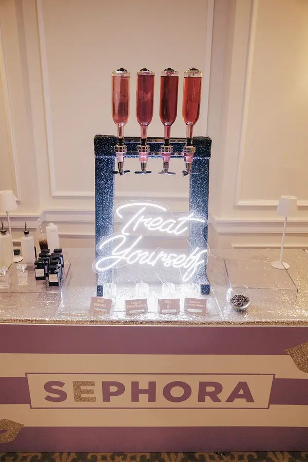 Ella's Bat Mitzvah Sephora perfume bar with Treat Yourself neon sign