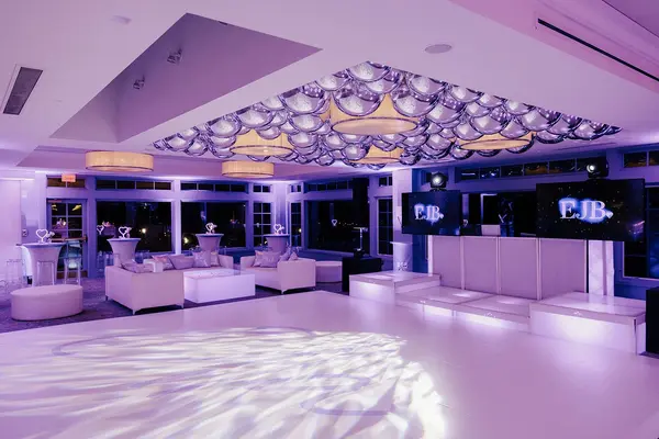Ella's Bat Mitzvah white dance floor, lounge and silver balloon ceiling