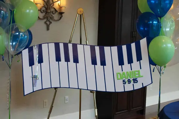 Piano Keys Shaped Sign in Board