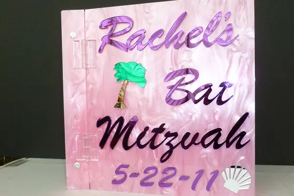 Pink Lucite Sign in Book
