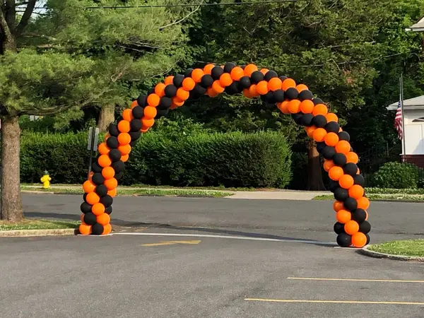 Orange and Black Balloon Arch