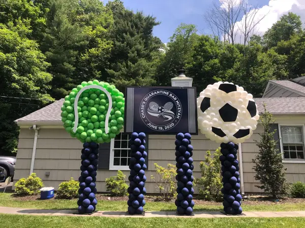 Custom Logo Sign with Sports Ball Sculptures