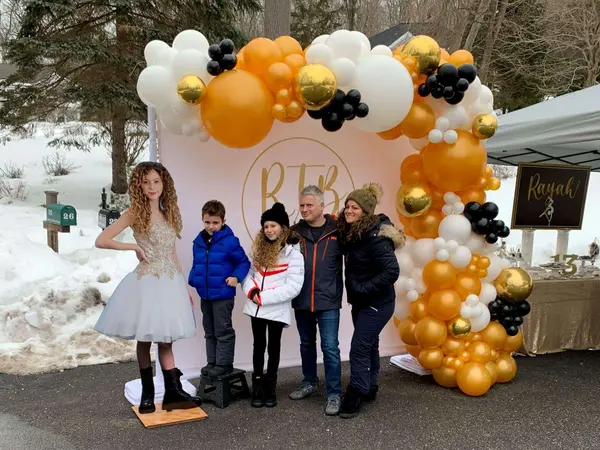 Organic Balloon Arch Over Custom Backdrop
