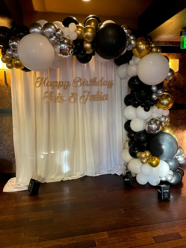 Organic Balloon Arch Over Signage